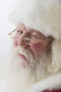 Close up of Santa Claus winking.