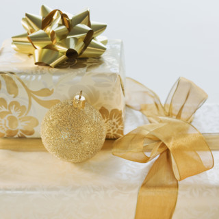 Ornament on pile of gifts.