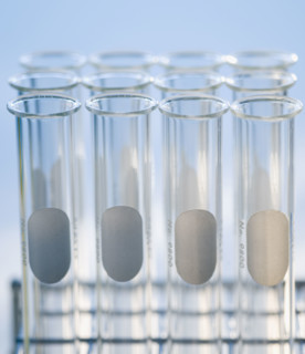 Close up of empty vials in tray .