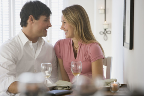 Couple smiling at each other.