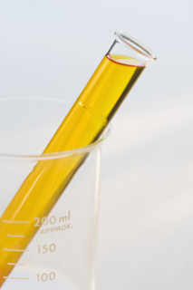 Vial of liquid in beaker.