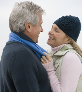 Couple smiling at each other.