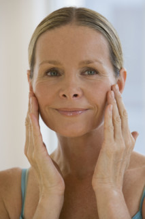 Woman with hands on face.