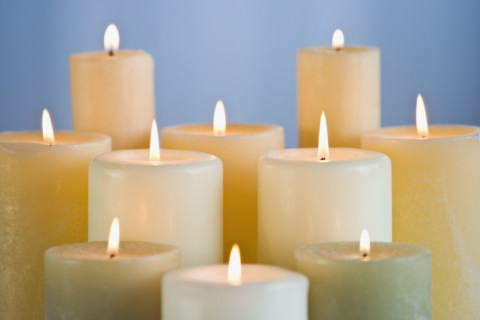 Close up of lit candles.