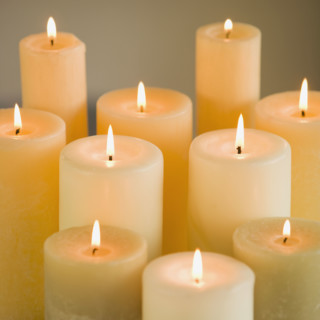 Close up of lit candles.