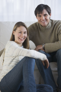 Couple sitting in livingroom.