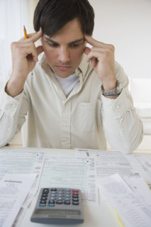 Man preparing taxes.