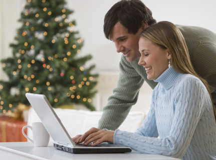 Couple looking at laptop.