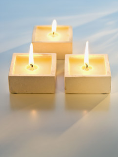 Close up of lit candles.