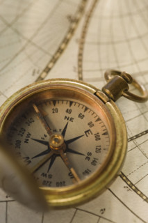 Compass on antique map.