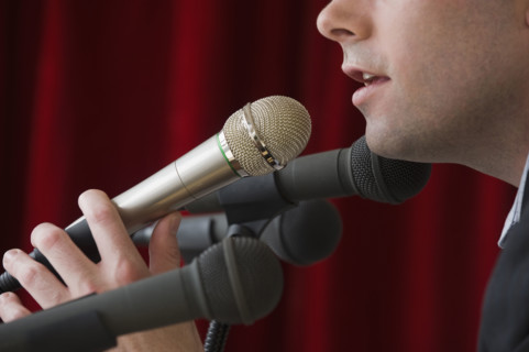 Man speaking into microphone.