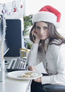 Businesswoman wearing Santa Claus hat. Date : 2008