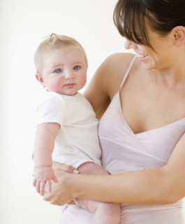Mother smiling at baby. Date : 2008