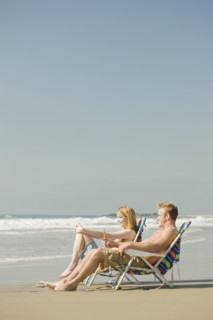 Couple sitting in beach chairs. Date : 2008