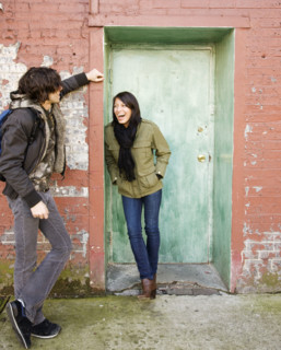 Couple talking in urban doorway. Date : 2008