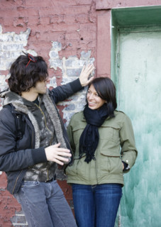 Couple talking in urban doorway. Date : 2008