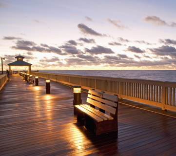 benches on pier during sunrise/sunset. Date : 2008