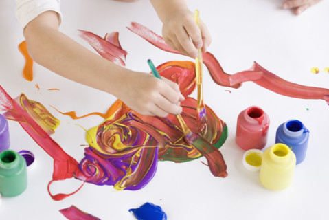 Children painting on table. Date : 2008