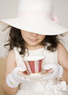 Hispanic girl dressed up at tea party. Date : 2008