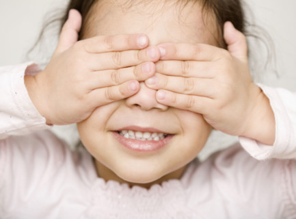 Hispanic girl covering eyes. Date : 2008