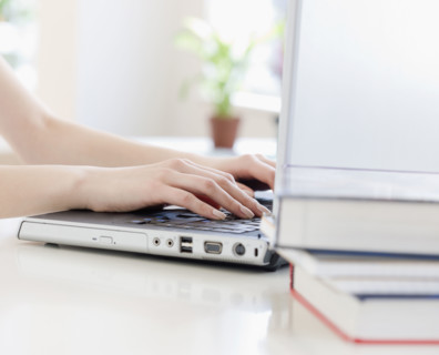 Woman typing on laptop. Date : 2008
