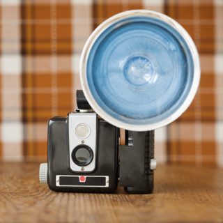 Old fashioned camera on table. Date : 2008