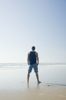 Man standing on beach. Date : 2008