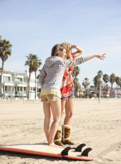 Two young women standing on beach. Date : 2008