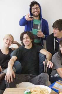 Group of friends watching television. Date : 2008