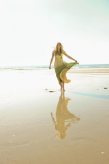 Woman walking on beach. Date : 2008