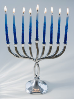 Close up of menorah with lit candles. Date : 2008
