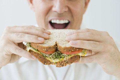 Man eating sandwich.