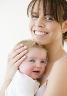 Mother hugging baby. Date : 2008