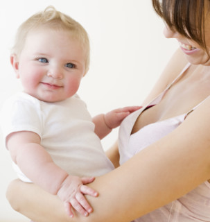 Mother smiling at baby. Date : 2008