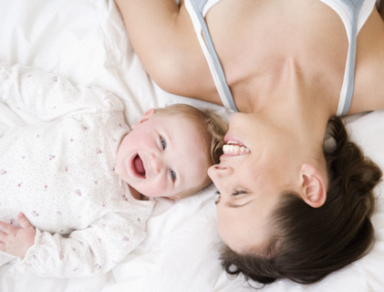 Mother and baby laughing. Date : 2008
