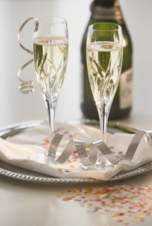 Glasses of champagne on tray.