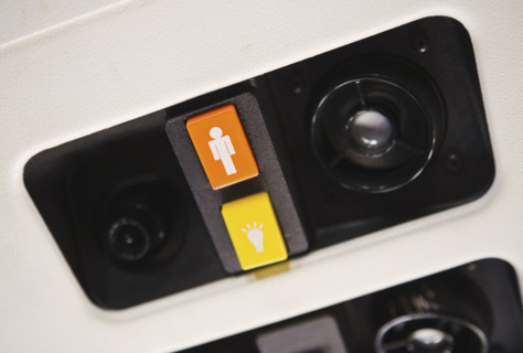 Close up of airplane call button.