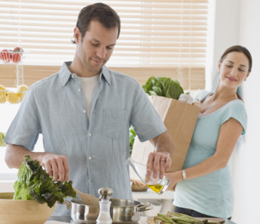 Hispanic couple preparing food.