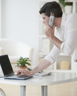 Man talking on telephone.