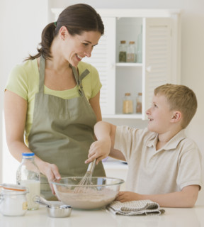 Mother and son making batter.