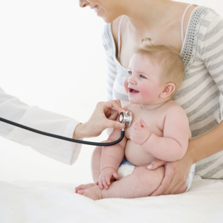 Baby being examined by doctor. Date : 2008