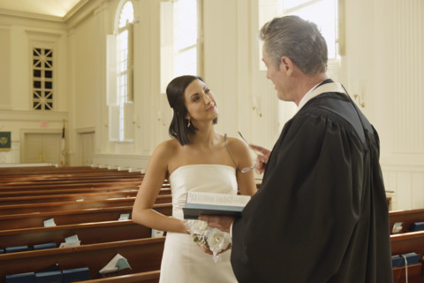 Priest talking to bride. Date : 2008
