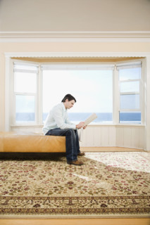 Man reading newspaper. Date : 2008