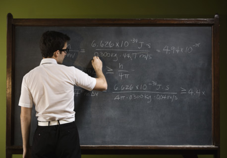 Man writing on blackboard. Date : 2008