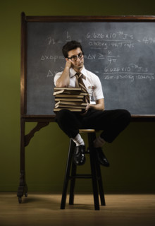 Nerdy man in front of blackboard. Date : 2008