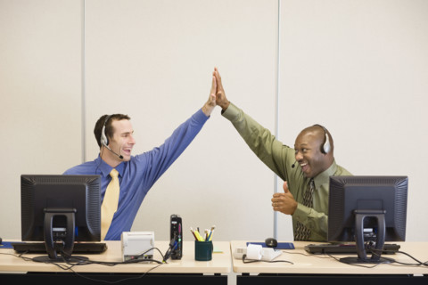 Multi-ethnic businessmen high-fiving. Date : 2008