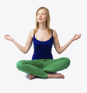 Studio shot of woman meditating. Date : 2008