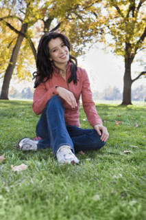 Woman sitting in grass. Date : 2008