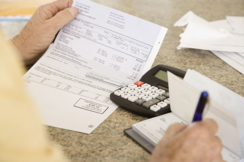 Senior man paying bills. Date : 2008
