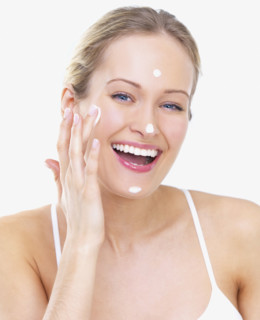 Woman applying face cream. Date : 2008